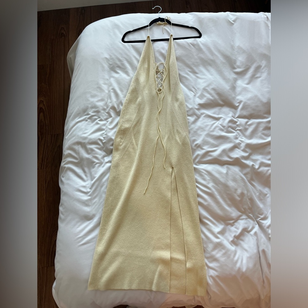 Pale yellow knit open back halter dress with slit